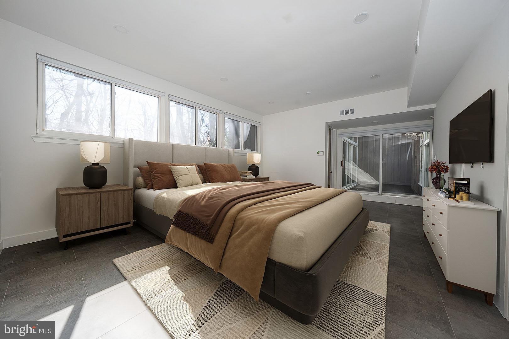 39-41 Fairview Road Penn Valley, PA 19072 - Photo 10 of 37 a bedroom with bed and flat screen tv