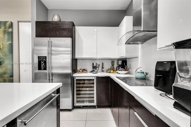 a kitchen with a sink a stove and cabinets