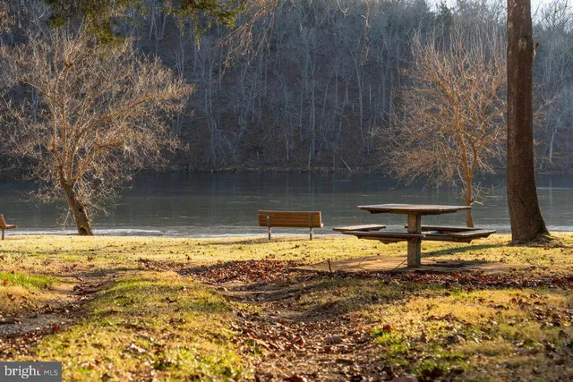 a view of a house with trees in the background
