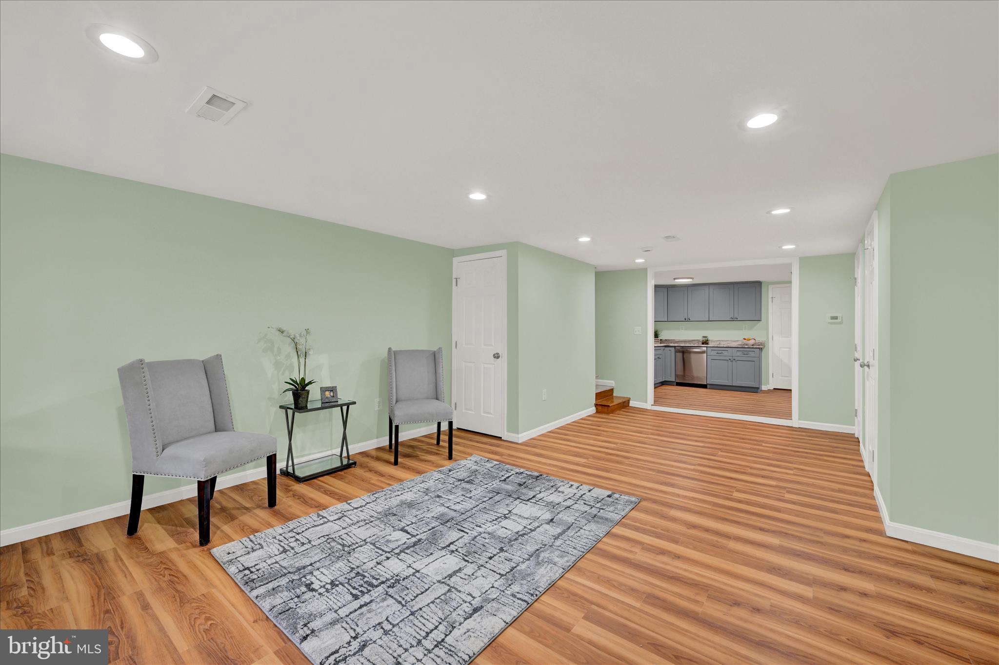 8511 Frederick Road Ellicott City, MD 21043 - Photo 10 of 36 a view of a livingroom with furniture and wooden floor