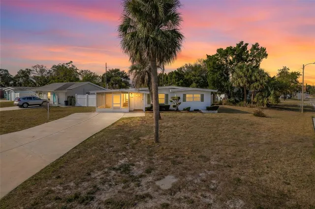 a kitchen with stainless steel appliances granite countertop a sink stove and microwave