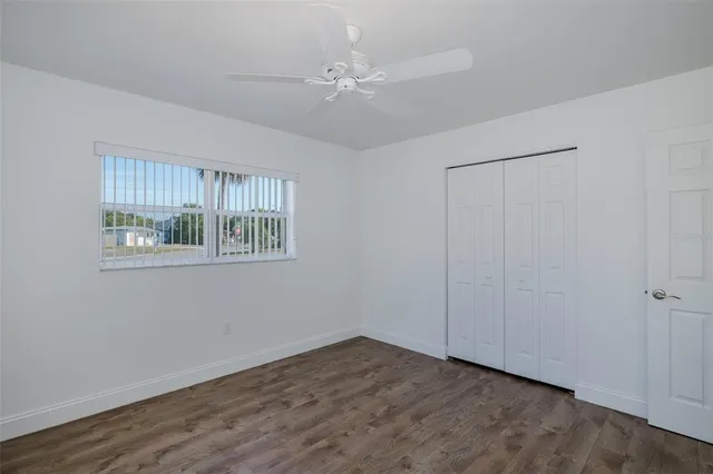 a house with a yard and a large tree