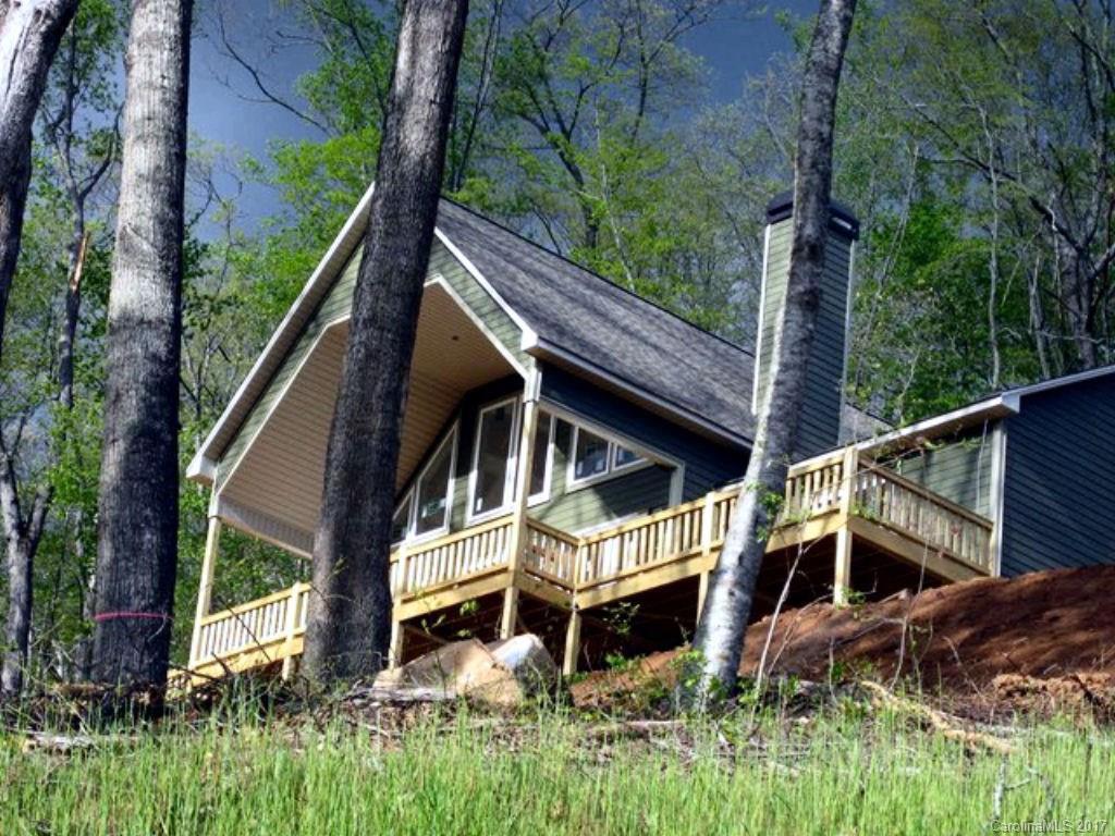 31 Lick Log Road Sylva, NC 28779 - Photo 3 of 24 a view of house with a yard and potted plants