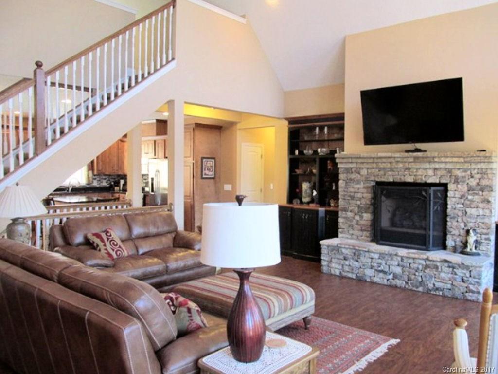 31 Lick Log Road Sylva, NC 28779 - Photo 5 of 24 a living room with fireplace furniture and a flat screen tv