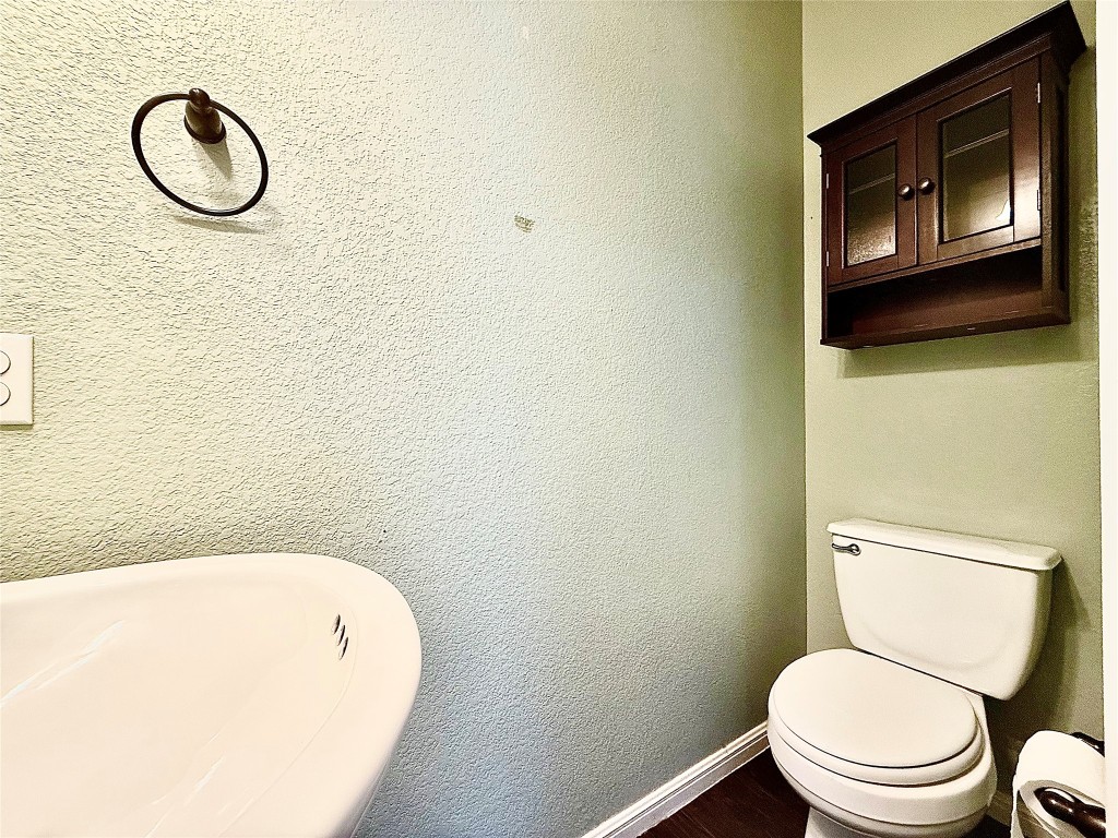1900 Little Elm Trail, Unit 105 Cedar Park, TX 78613 - Photo 12 of 31 a bathroom with a toilet and a sink