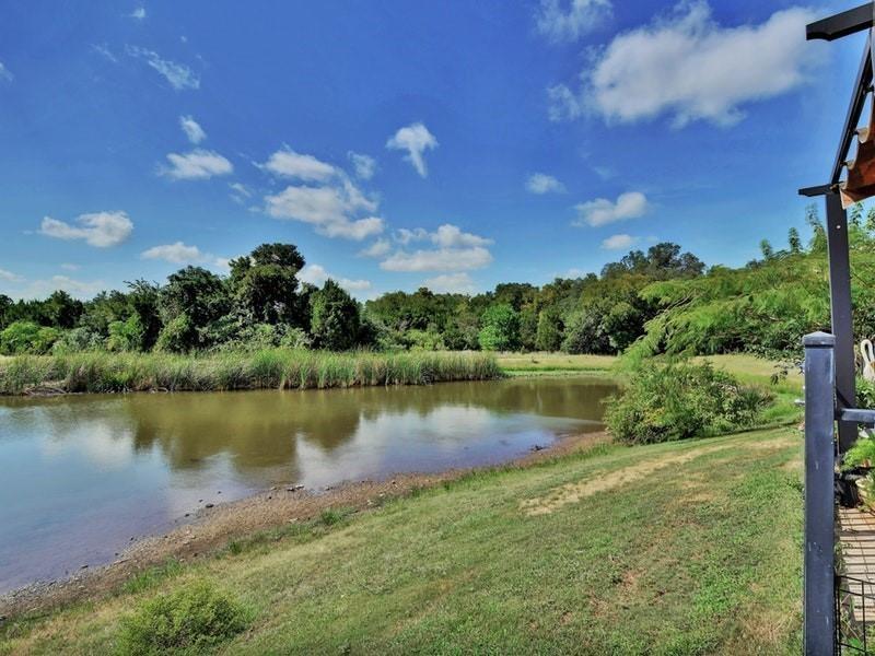 1900 Little Elm Trail, Unit 105 Cedar Park, TX 78613 - Photo 27 of 31 a view of a lake in between the city and lake