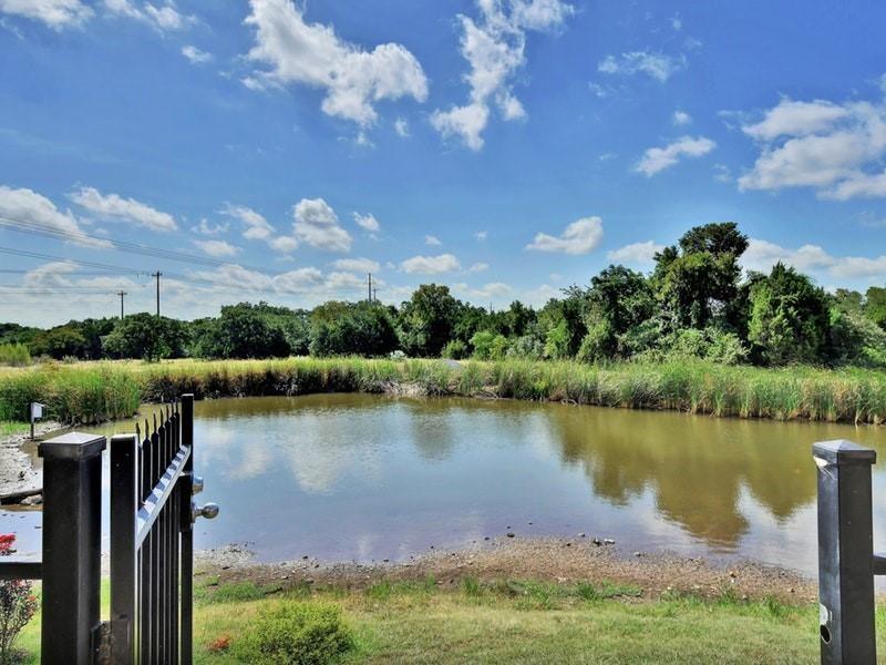 1900 Little Elm Trail, Unit 105 Cedar Park, TX 78613 - Photo 28 of 31 a view of a lake with a mountain in the background