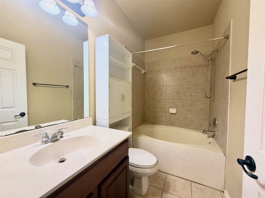 1900 Little Elm Trail, Unit 105 Cedar Park, TX 78613 - Photo 9 of 31 a bathroom with a sink mirror toilet and bathtub