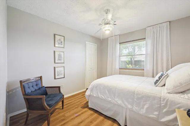 a bedroom with a bed and a chair