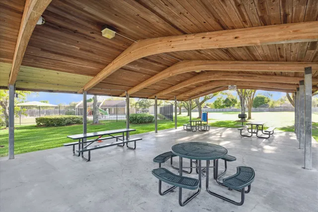 a view of a swimming pool with a patio