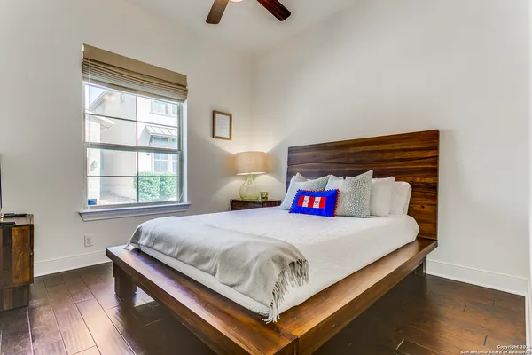 a bedroom with a bed and window