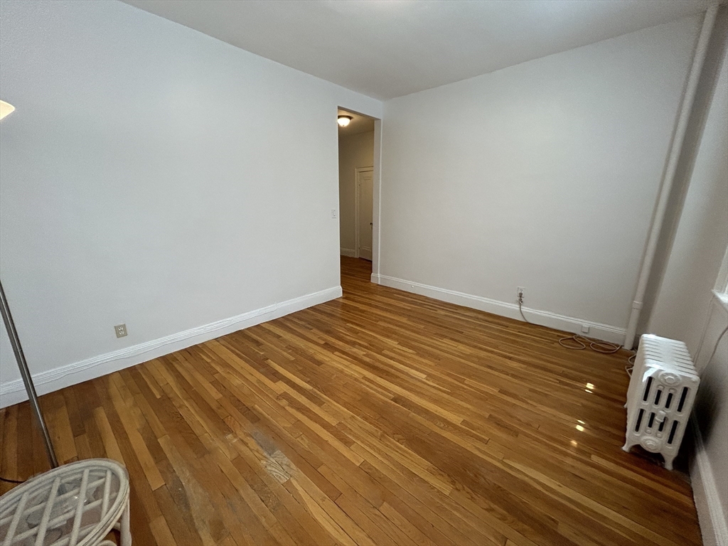 48 Strathmore Road, Unit 4 Boston, MA 02135 - Photo 4 of 10 a view of room with wooden floor