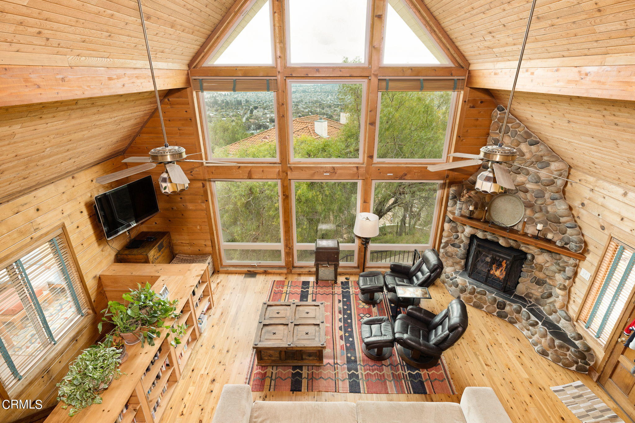 22 Santa Cruz Way Camarillo, CA 93010 - Photo 14 of 58 a living room with furniture a flat screen tv and a floor to ceiling window