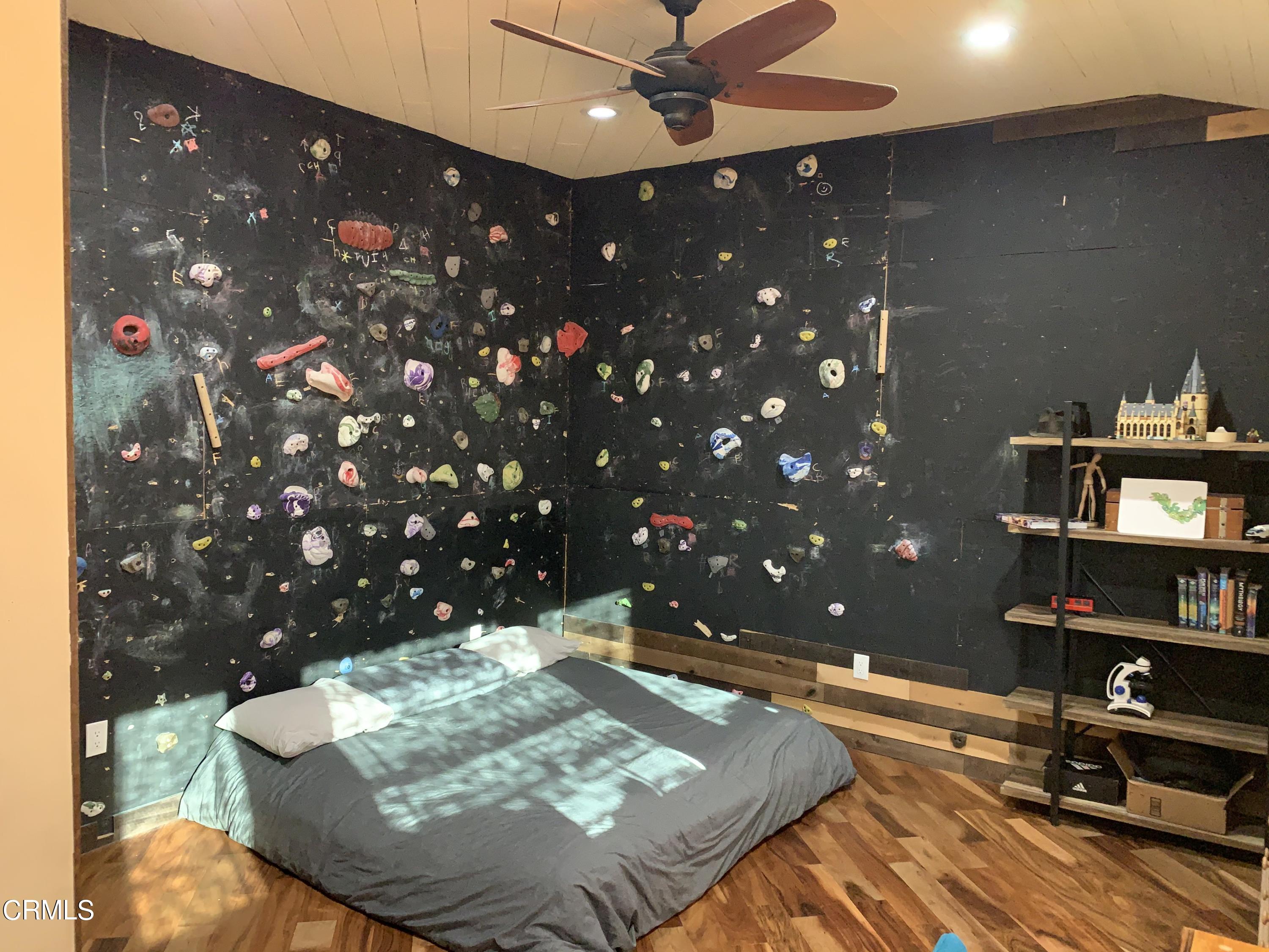 22 Santa Cruz Way Camarillo, CA 93010 - Photo 36 of 58 a wooden floor with glass top table and chairs