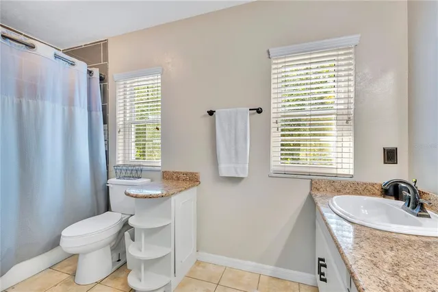 a bed room with a bed and a window