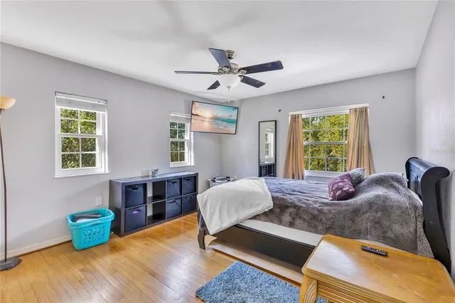 a view of a dining room with furniture large windows and wooden floor