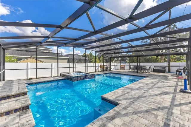a view of a backyard with large trees