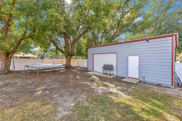 a view of a garage with a bike and white walls