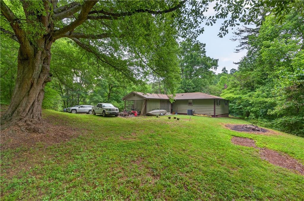 4399 Highway 411 Rydal, GA 30171 - Photo 28 of 37 a front view of a house with garden