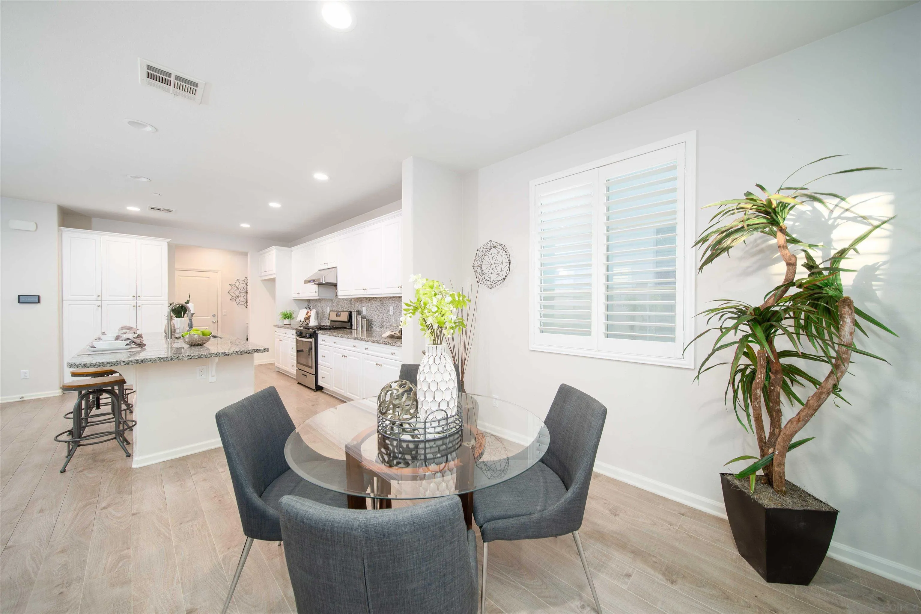 31556 Alicante Loop Winchester, CA 92596 - Photo 41 of 46 a dining room with furniture and a potted plant