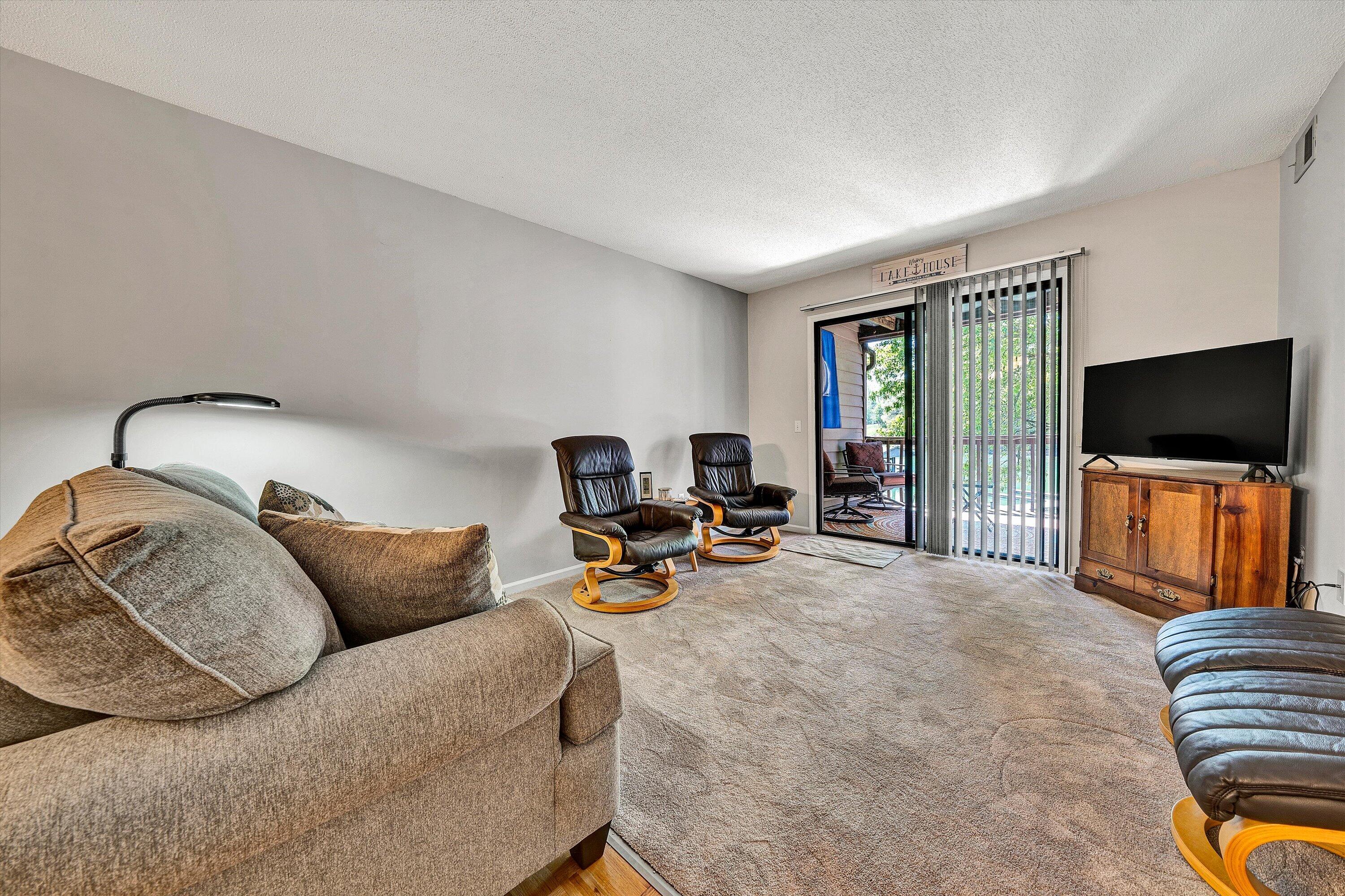 620 Monte Vista Road, Unit 605 Union Hall, VA 24176 - Photo 8 of 41 a living room with furniture and a flat screen tv