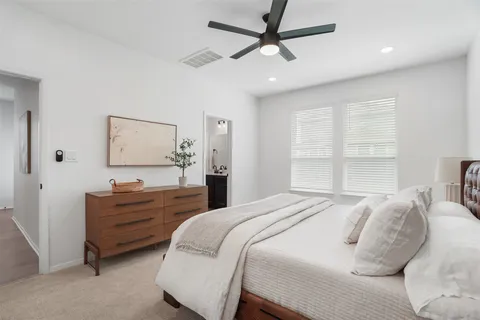 a bedroom with a bed and furniture