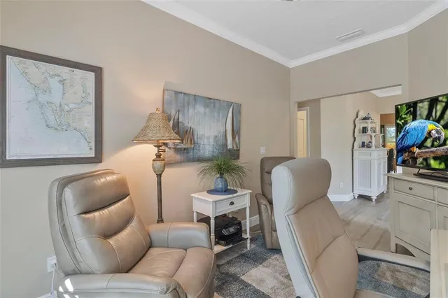 a spacious bedroom with a bed a couch and a window