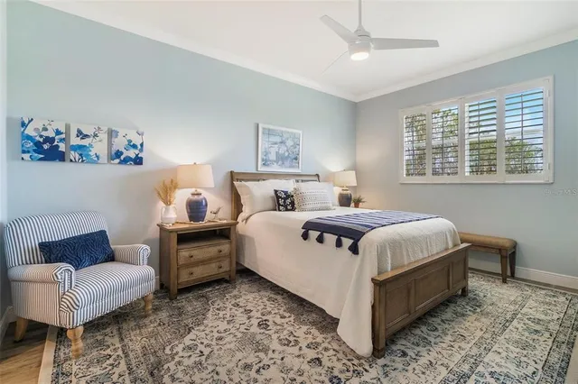 a bedroom with a bed and lamp