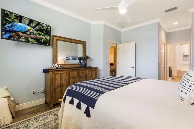 a bathroom with a sink double vanity granite tub and a mirror