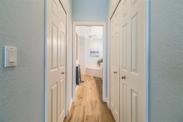 a spacious bathroom with a double vanity sink a mirror and a shower