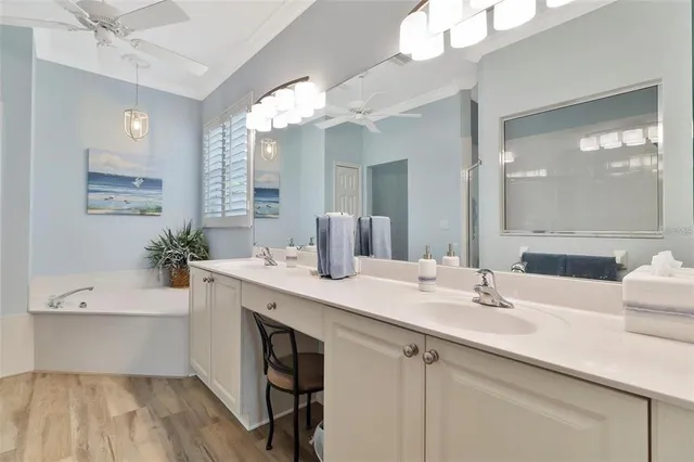 a white bath tub sitting next to a white sink