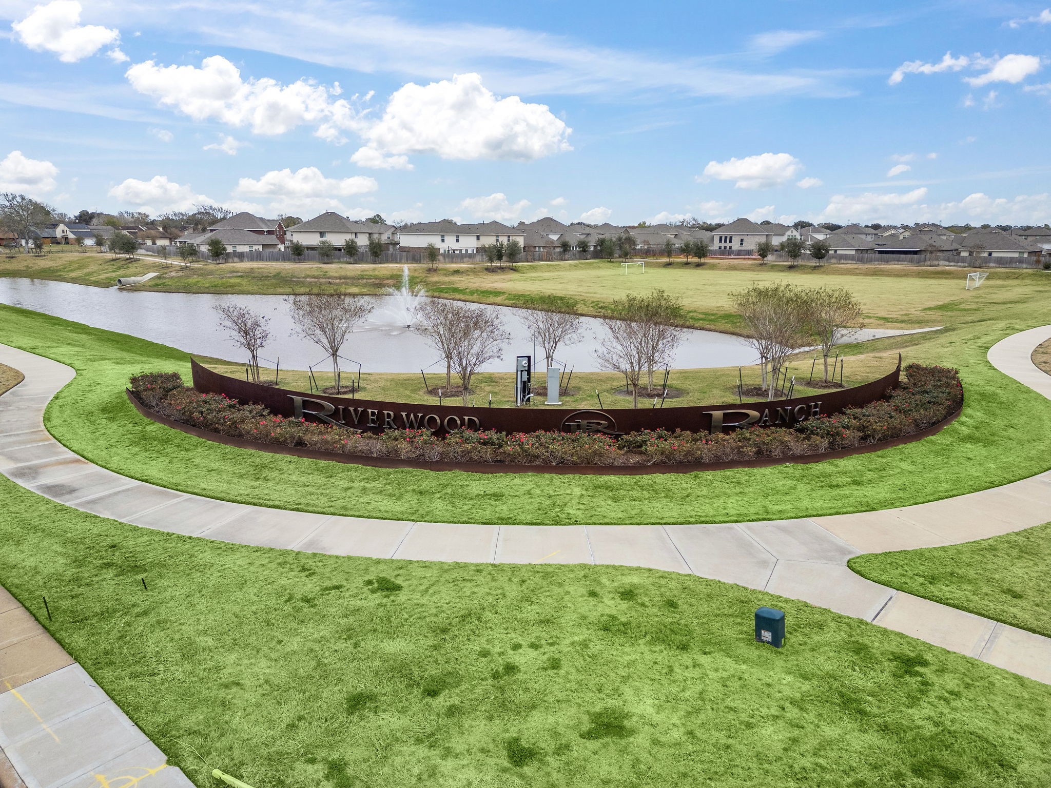 308 Amy Street Angleton, TX 77515 - Photo 22 of 27 a view of a lake with houses in the back