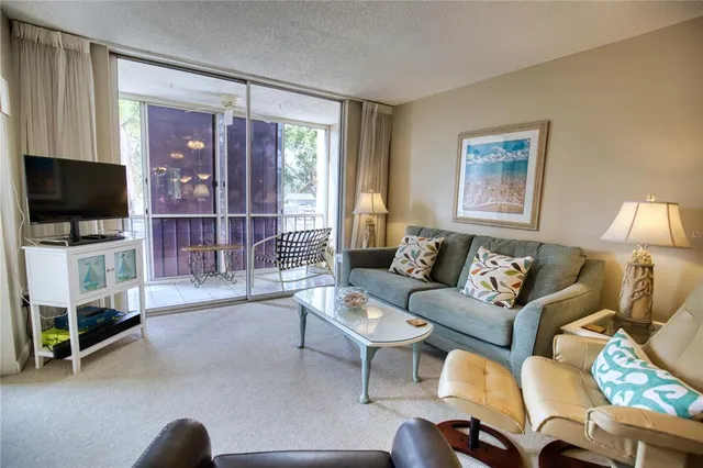 a view of a room with furniture and a gate