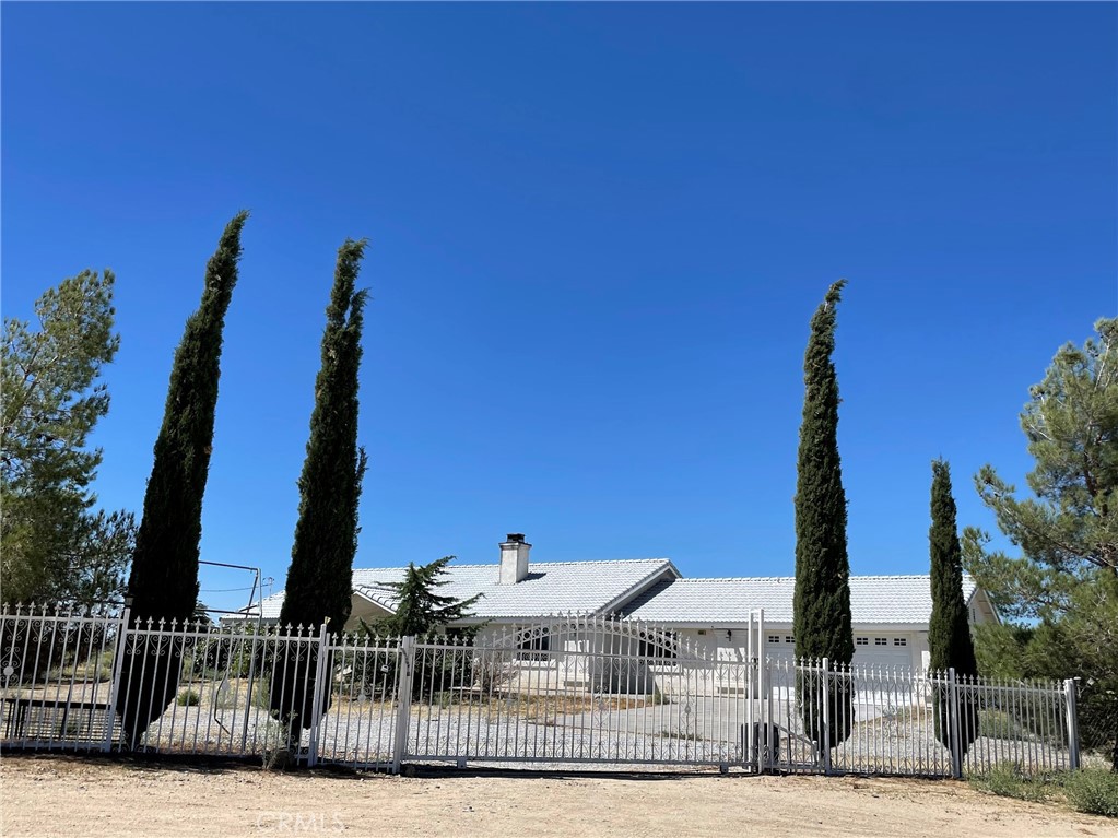 4664 Del Rosa Road Phelan, CA 92371 - Photo 1 of 1 a front view of a building with glass door