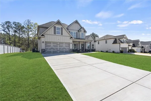 front view of a house with a yard