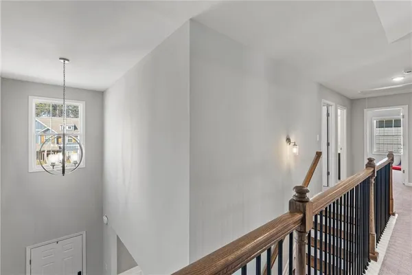 a view of a hallway with windows