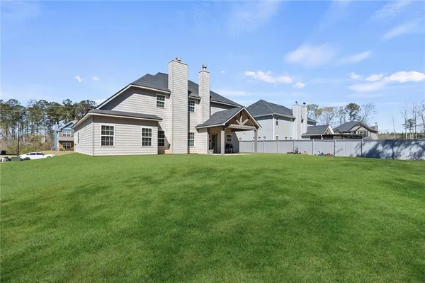 a front view of a house with a yard