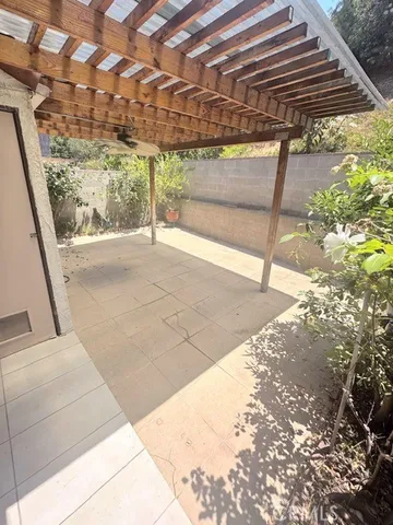 a kitchen with stainless steel appliances a sink a stove a refrigerator cabinets and a counter top space