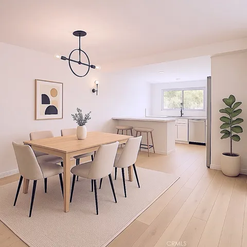 a bedroom with a large bed and a potted plant