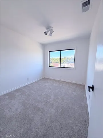 an empty room with a empty space and window