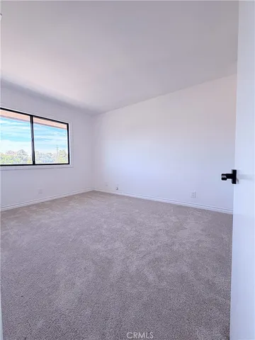 a view of a livingroom with an empty space and window