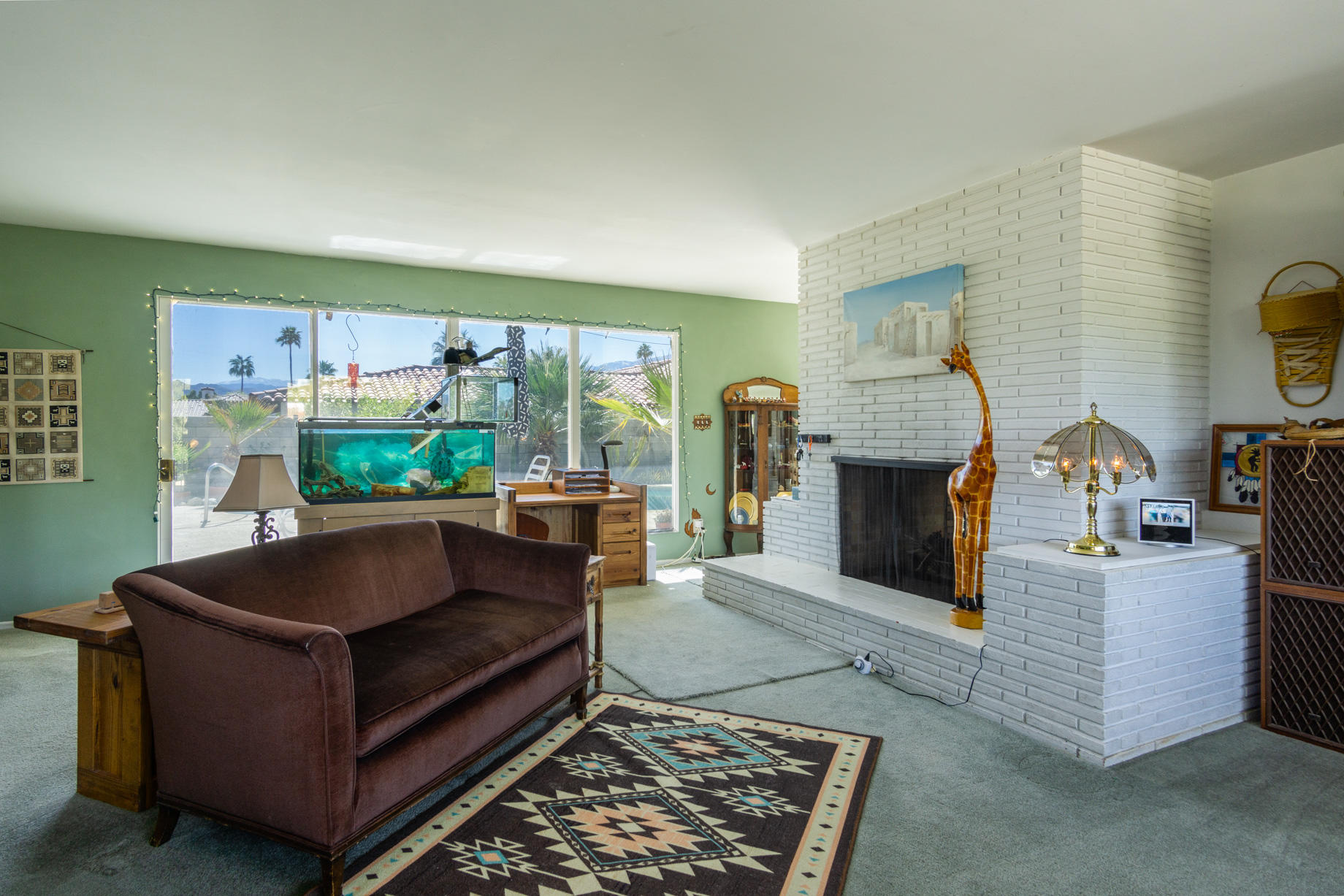 1225 Pasatiempo Road Palm Springs, CA 92262 - Photo 4 of 17 a living room with furniture and a fireplace
