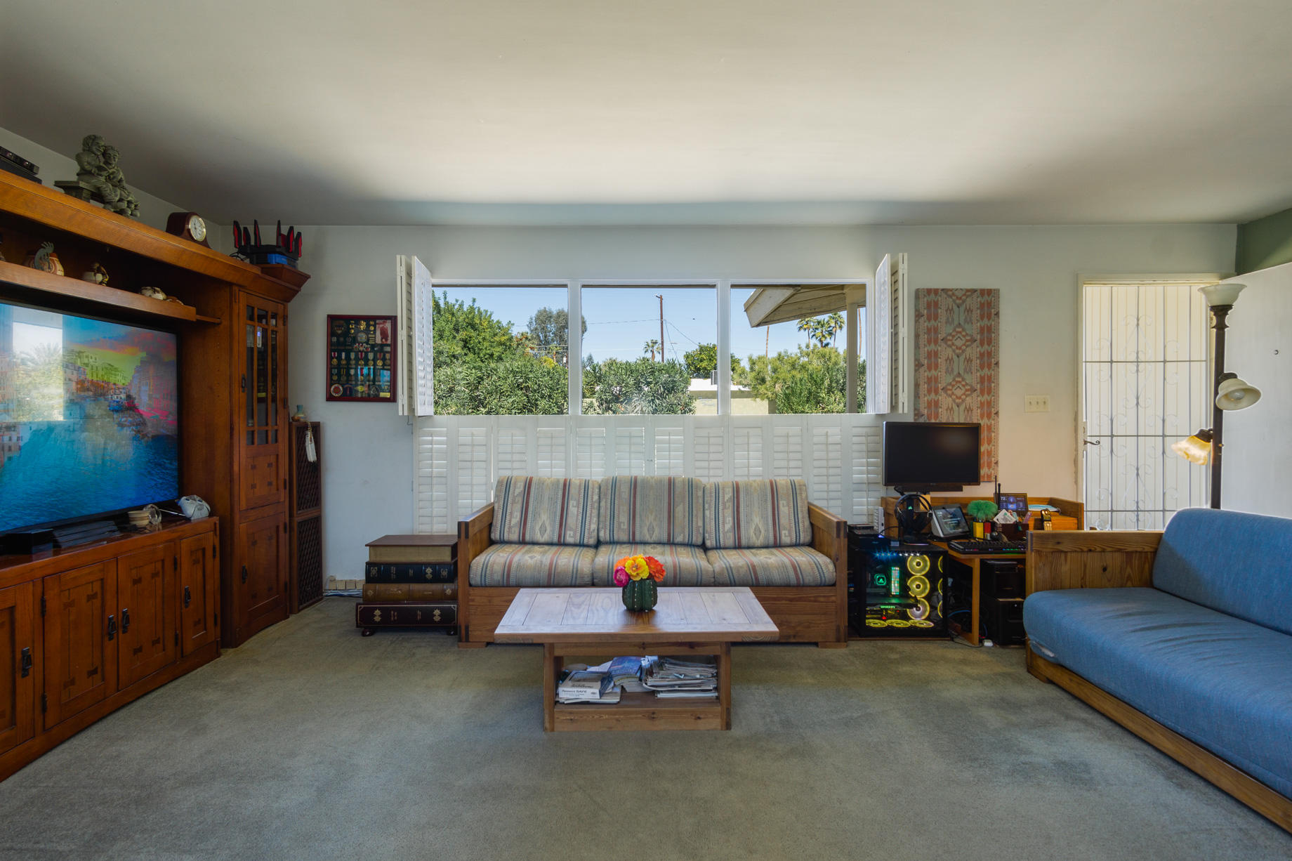 1225 Pasatiempo Road Palm Springs, CA 92262 - Photo 5 of 17 a living room with furniture and a flat screen tv
