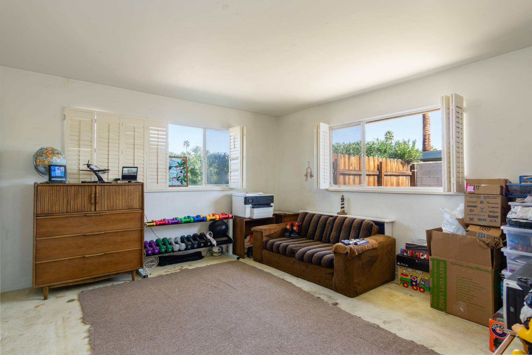 1225 Pasatiempo Road Palm Springs, CA 92262 - Photo 8 of 17 a living room with furniture and a window