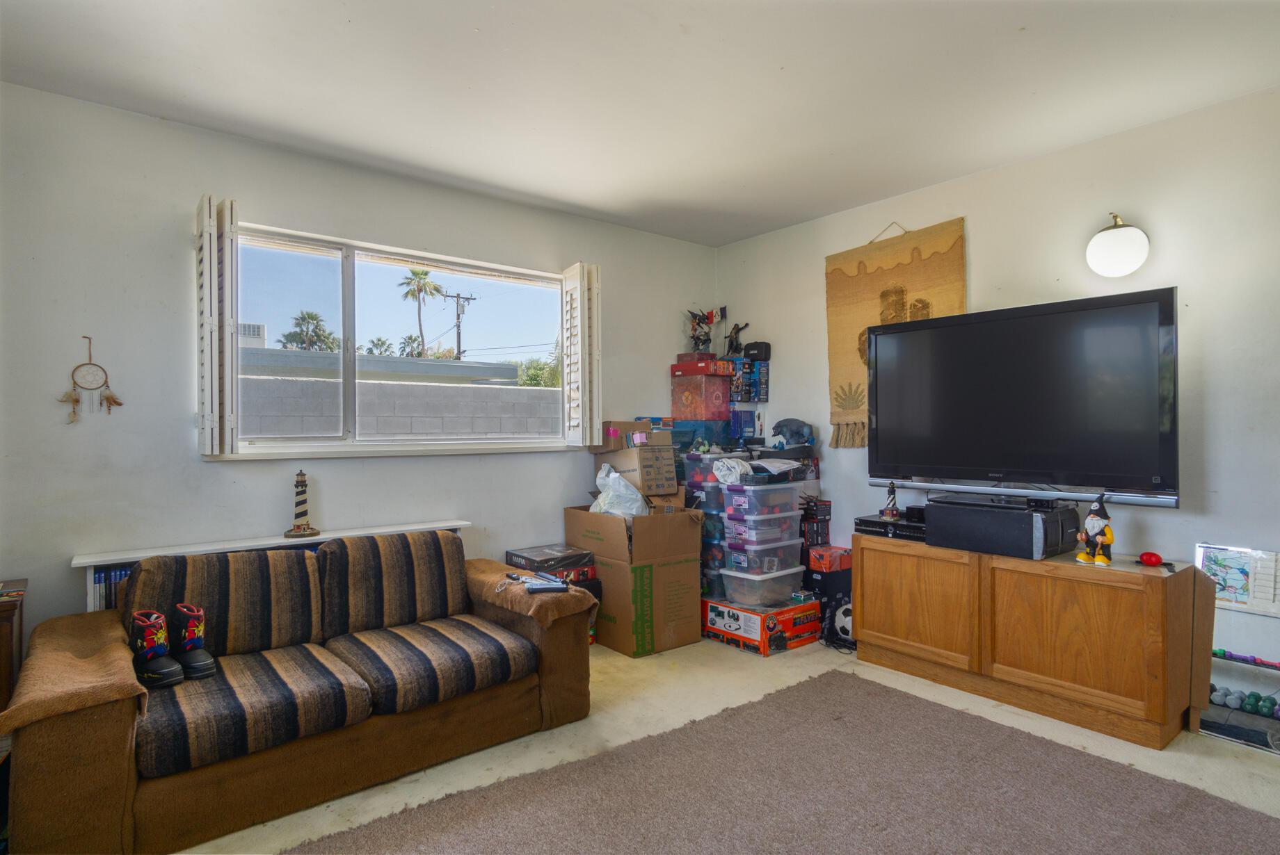 1225 Pasatiempo Road Palm Springs, CA 92262 - Photo 9 of 17 a living room with furniture and a flat screen tv