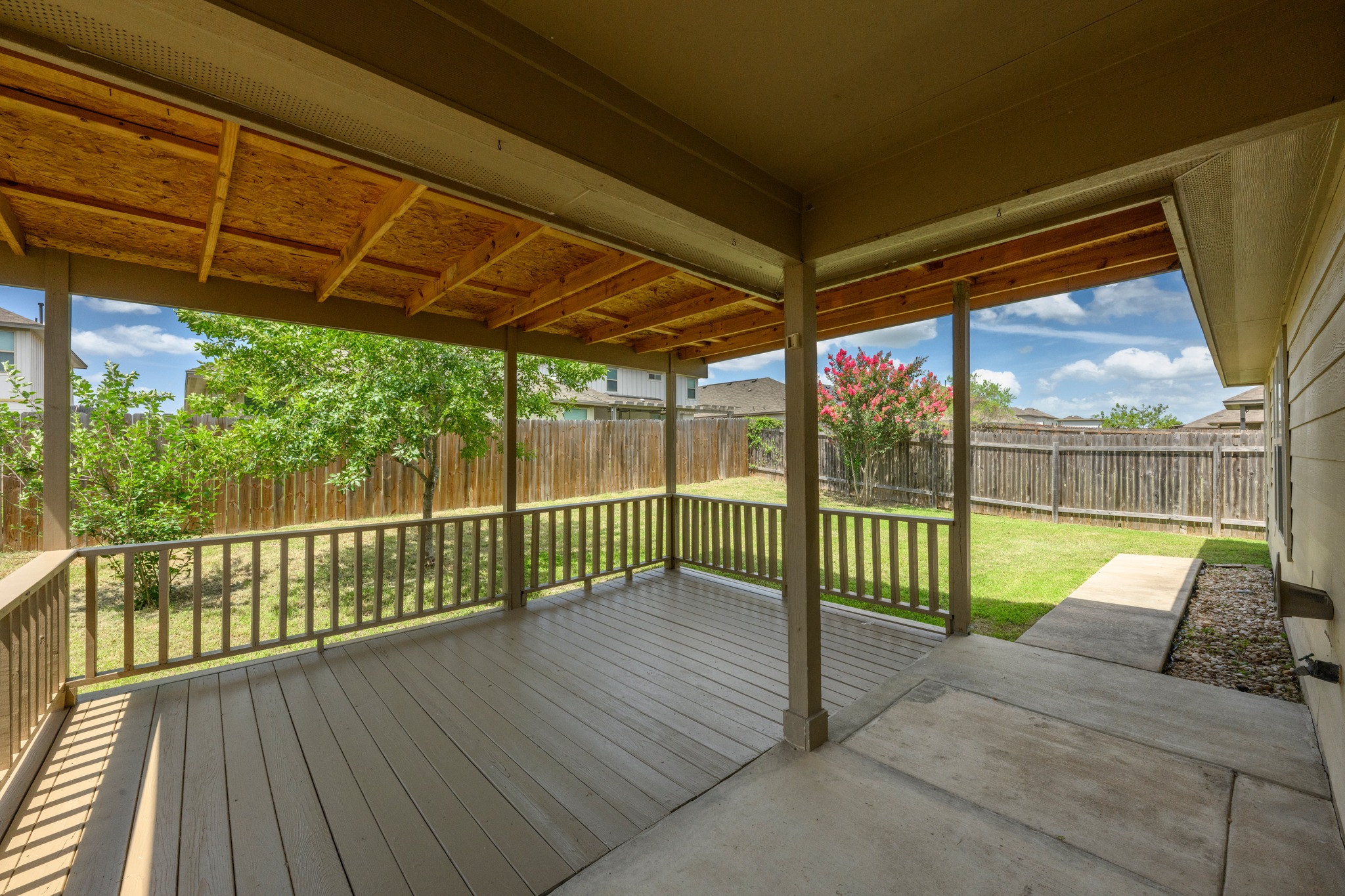 278 Noddy Road Buda, TX 78610 - Photo 3 of 17 Enjoy outdoor moments on this spacious covered deck, perfect for relaxation or entertaining.