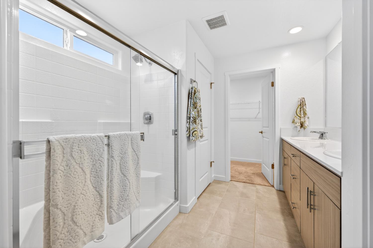 317 Talus Way South Madera, CA 93636 - Photo 32 of 61 a bathroom with a sink and mirror with shower