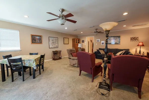 a view of a dining room with furniture and a livingroom