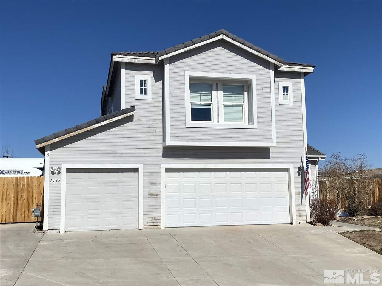 a front view of a house with a garage