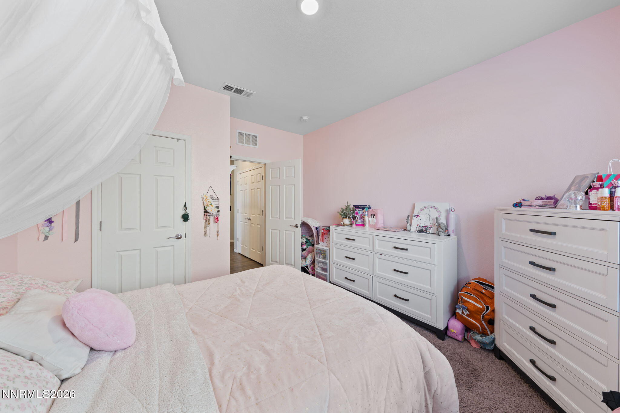 9708 Sea Glass Drive Reno, NV 89506 - Photo 14 of 51 a bedroom with a bed and a dresser